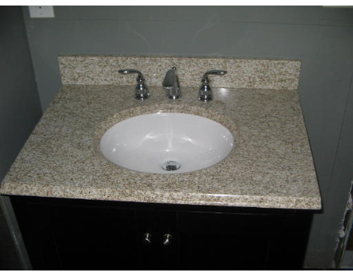 99 Parkton Road, Unit 1 Boston, MA 02130 - Photo 10 of 16 a bathroom with a sink and mirror
