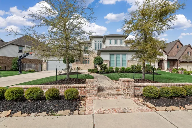 a view of a street with a house in the background