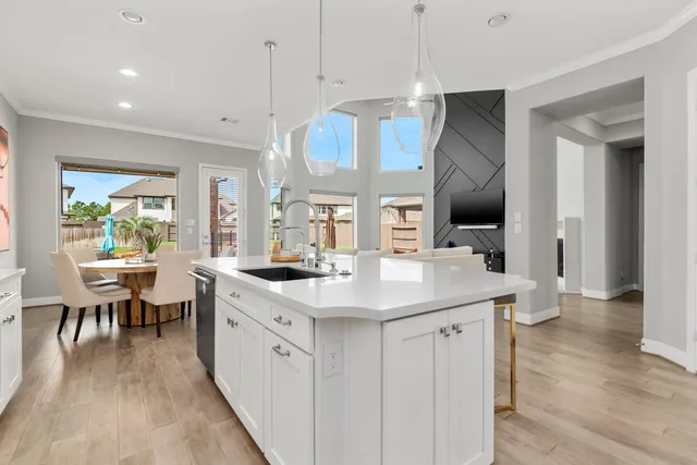 a kitchen with a sink and stove