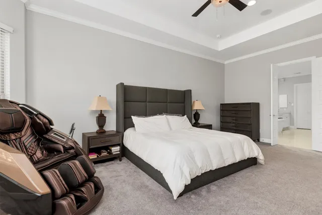 a bedroom with a bed and dresser