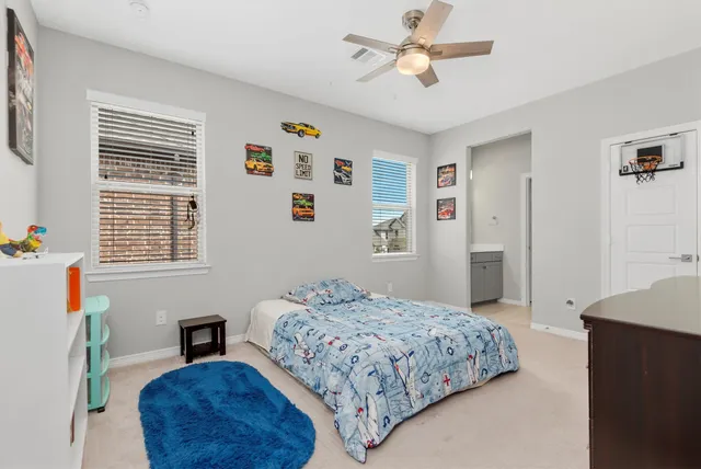 a bedroom with a bed furniture and a window