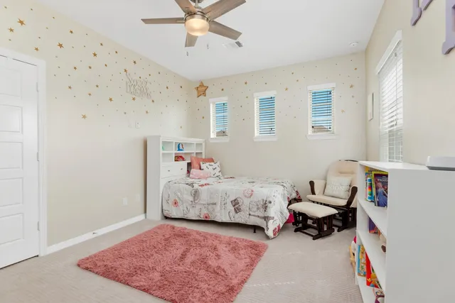 a bed room with a bed and a window