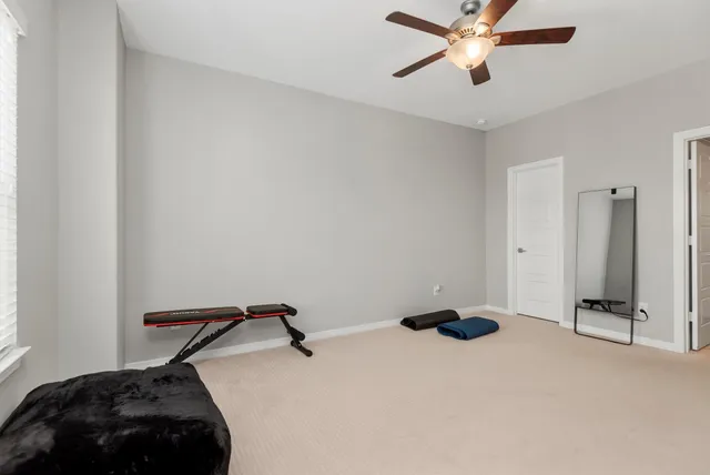 a bedroom with a bed and cabinets