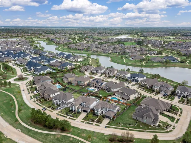 an aerial view of a houses with outdoor space