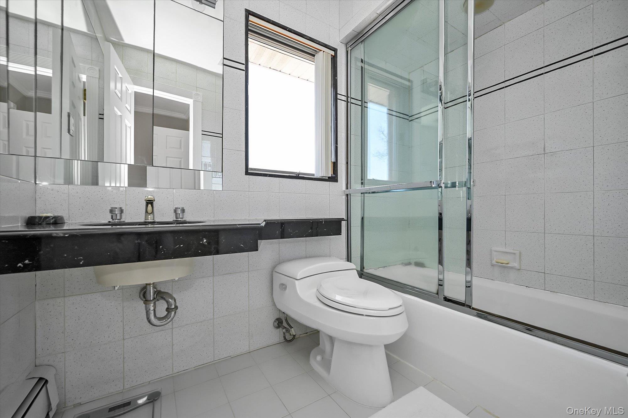 85 Meadow Woods Road Great Neck, NY 11020 - Photo 20 of 25 This is an ensuite bathroom for bedroom #4. Feature granite counter and tub with shower