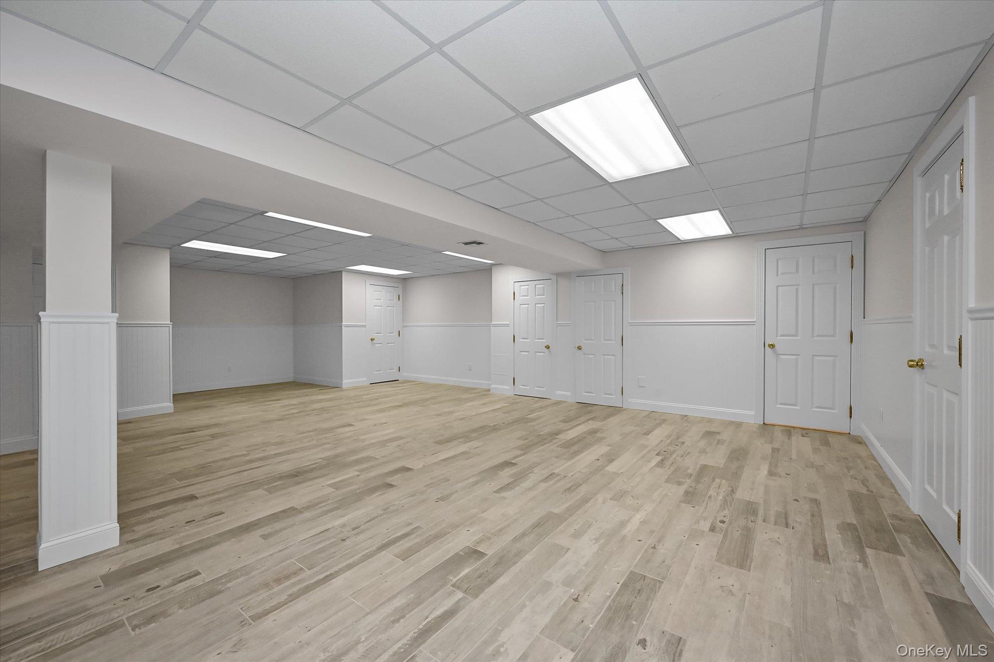 85 Meadow Woods Road Great Neck, NY 11020 - Photo 21 of 25 This recreation room features ample extra storage, a cedar closet, a full stall shower bathroom, and a bonus room with egress.