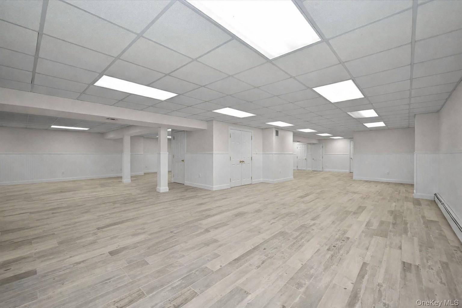 85 Meadow Woods Road Great Neck, NY 11020 - Photo 22 of 25 Sprawling recreation room complete with full stall shower bathroom