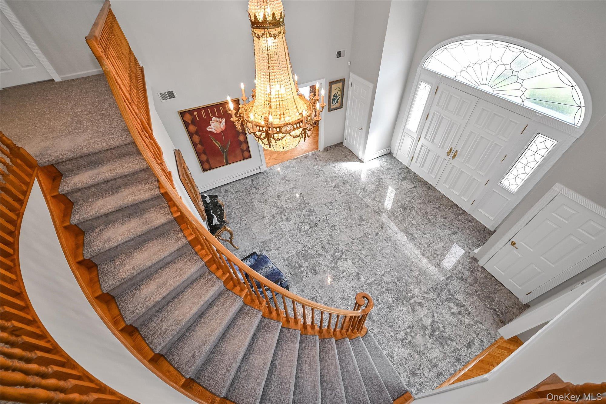 85 Meadow Woods Road Great Neck, NY 11020 - Photo 3 of 25 A stunning view of the foyer and entrance from the second floor.