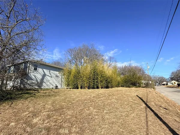 a view of large house with a yard