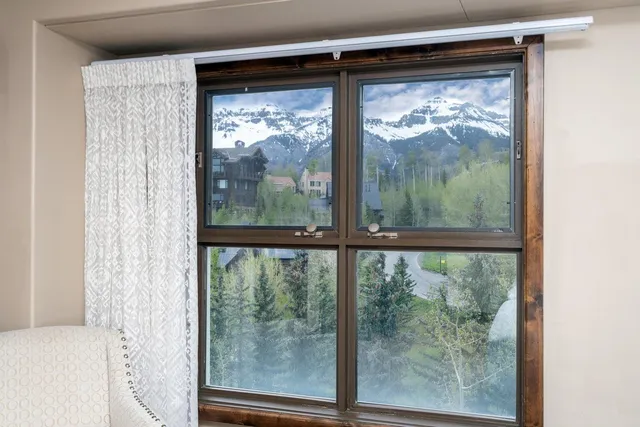 a view of a room that has a large window