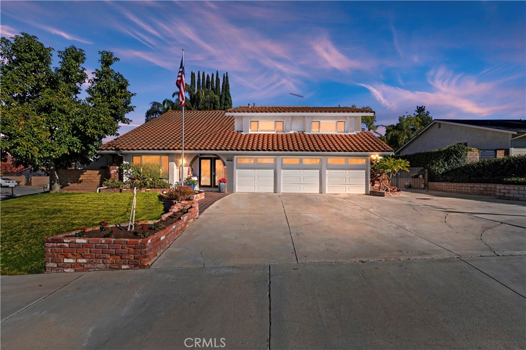 a house view with a garden space