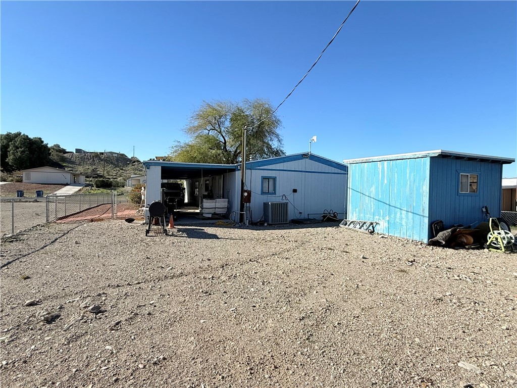 1637 Talc Road Bullhead City, AZ 86442 - Photo 29 of 37 Back of house featuring a patio and an outdoor structure