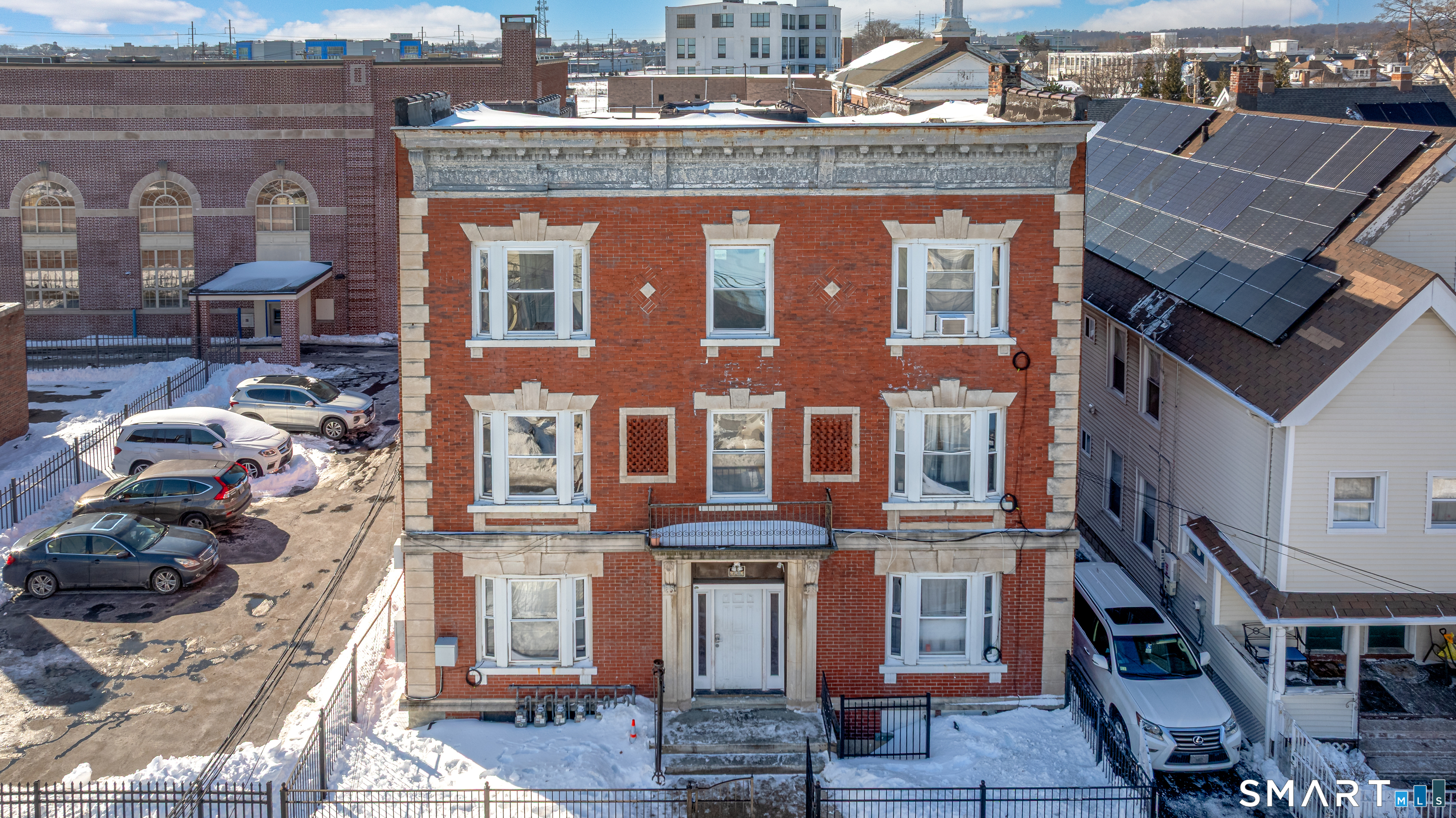 a front view of a building with many windows