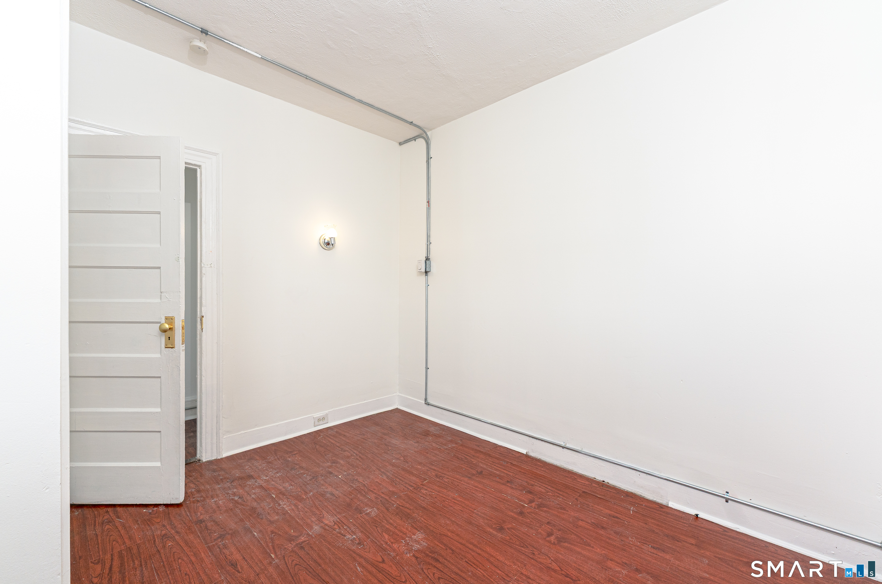 35 Butler Avenue, Unit 5 Bridgeport, CT 06605 - Photo 14 of 25 a view of an empty room with wooden floor