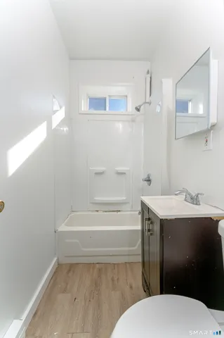 a bathroom with a toilet and a sink
