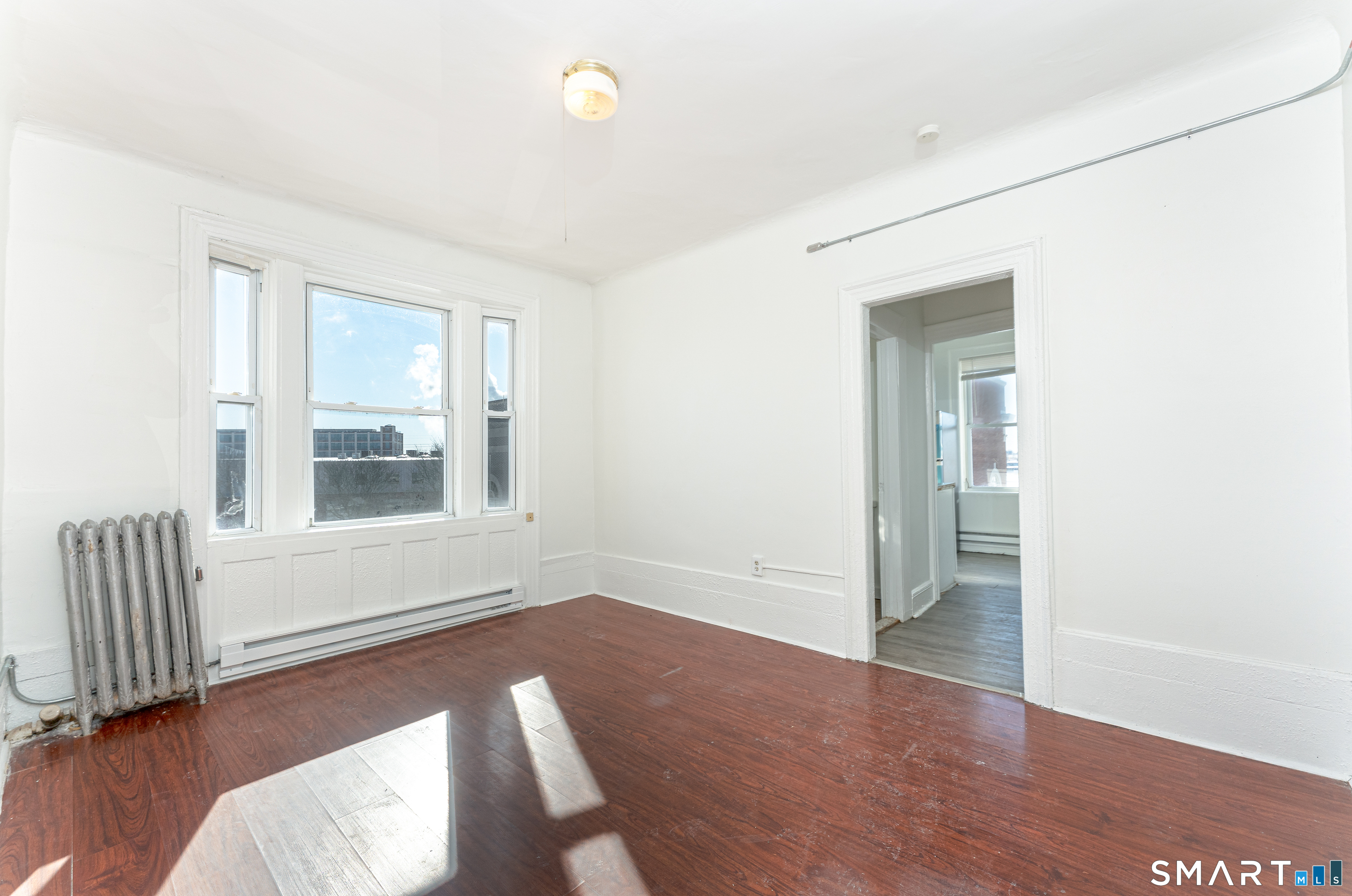 35 Butler Avenue, Unit 5 Bridgeport, CT 06605 - Photo 22 of 25 a view of livingroom with furniture and wooden floor