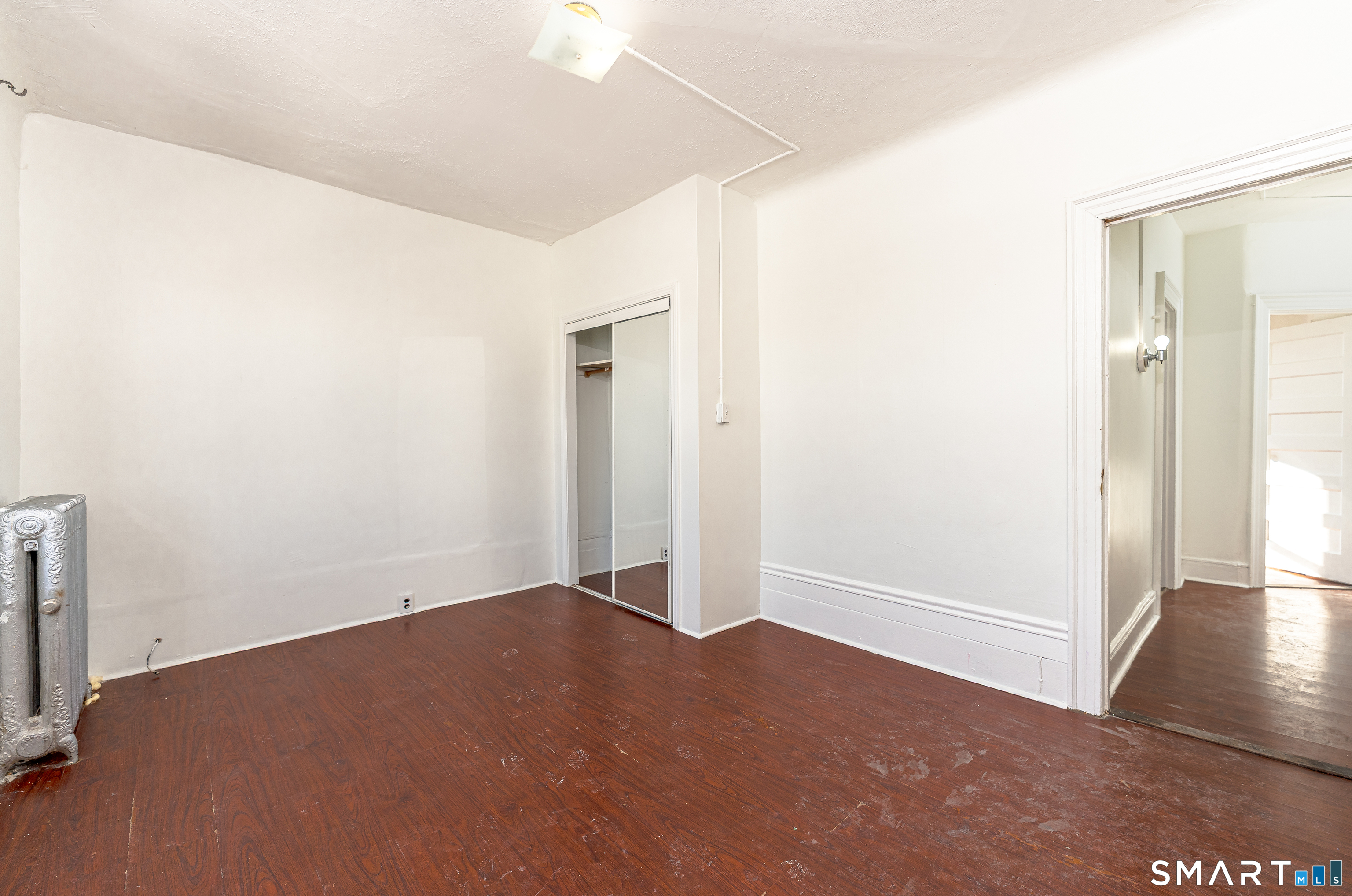 35 Butler Avenue, Unit 5 Bridgeport, CT 06605 - Photo 5 of 25 an empty room with windows
