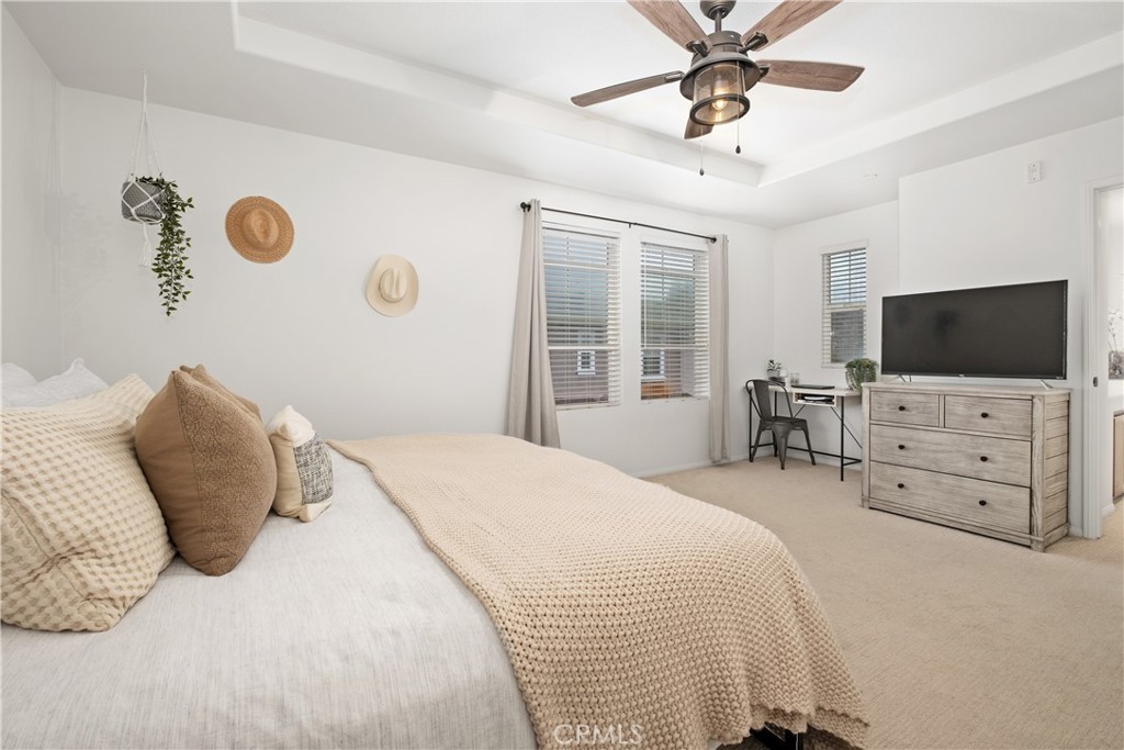 52 Valmont Way Ladera Ranch, CA 92694 - Photo 15 of 59 a bedroom with a bed and a flat screen tv