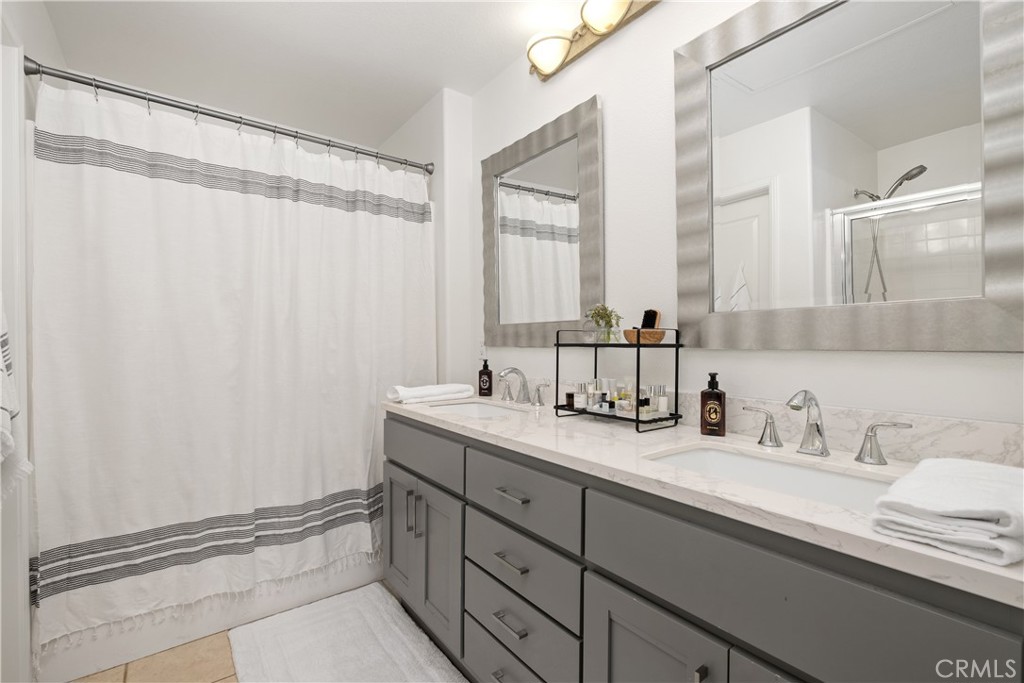 52 Valmont Way Ladera Ranch, CA 92694 - Photo 18 of 59 a bathroom with a sink and a mirror
