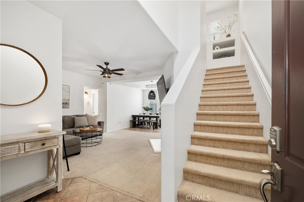 52 Valmont Way Ladera Ranch, CA 92694 - Photo 5 of 59 a view of a livingroom with furniture and a staircase