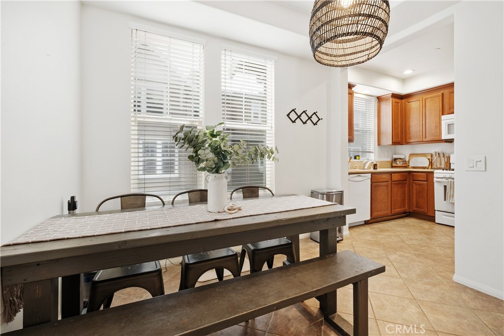 52 Valmont Way Ladera Ranch, CA 92694 - Photo 10 of 59 a kitchen with stainless steel appliances a sink and a stove