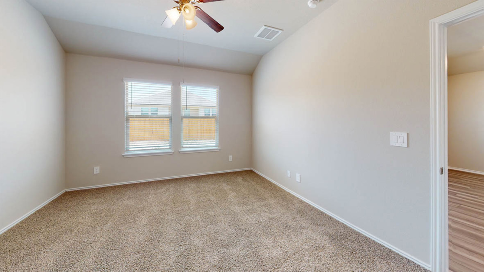 1303 Coriander Road Temple, TX 76501 - Photo 14 of 20 Carpeted room featuring two windows with blinds, a ceiling fan with integrated lighting, and neutral wall paint