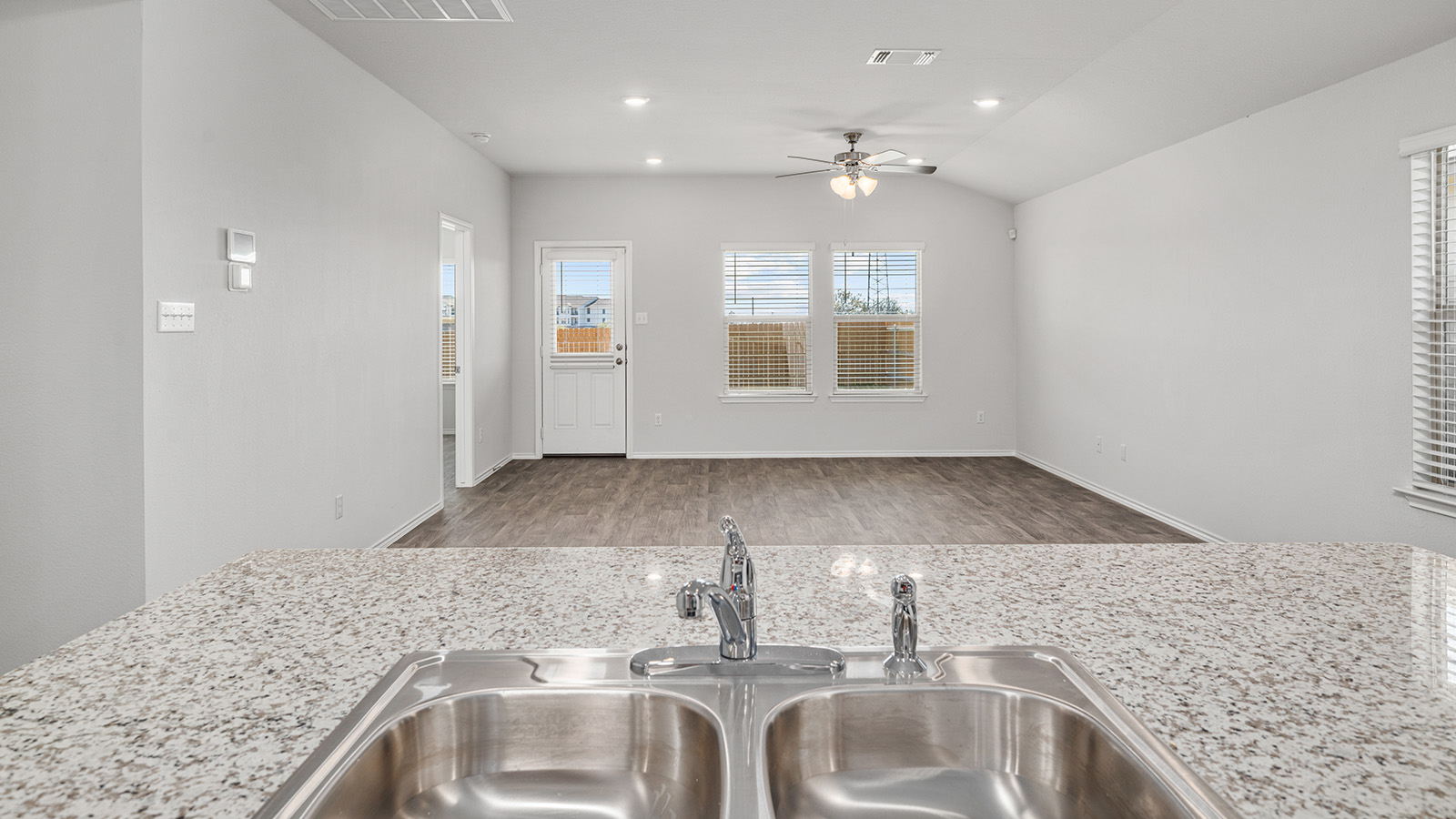 1303 Coriander Road Temple, TX 76501 - Photo 6 of 20 Kitchen sink with a dual basin, stainless steel faucet, and granite-look countertop