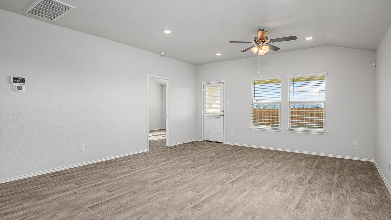 1303 Coriander Road Temple, TX 76501 - Photo 9 of 20 Spacious interior featuring wood-finish flooring, vaulted ceilings, and recessed lighting