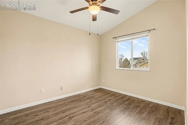 a view of room with window and ceiling fan