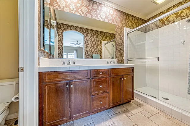 a bathroom with a sink a mirror and a shower