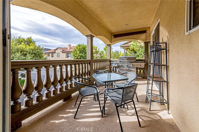 a view of a chairs and table in patio