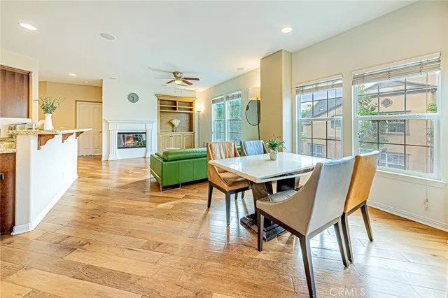 a dining room with furniture and wooden floor
