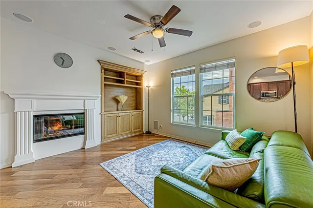 a living room with furniture rug and window