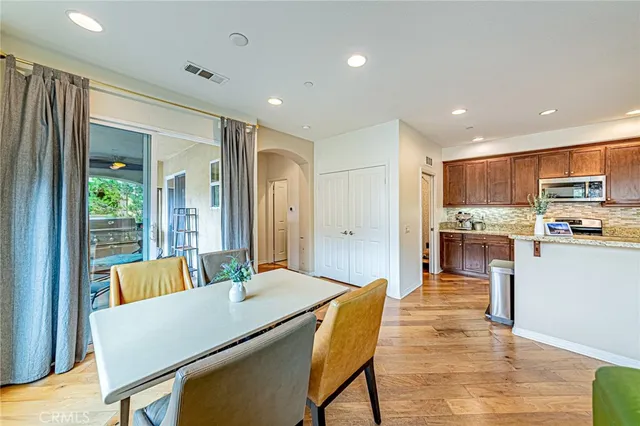a living room with kitchen island furniture and a kitchen view