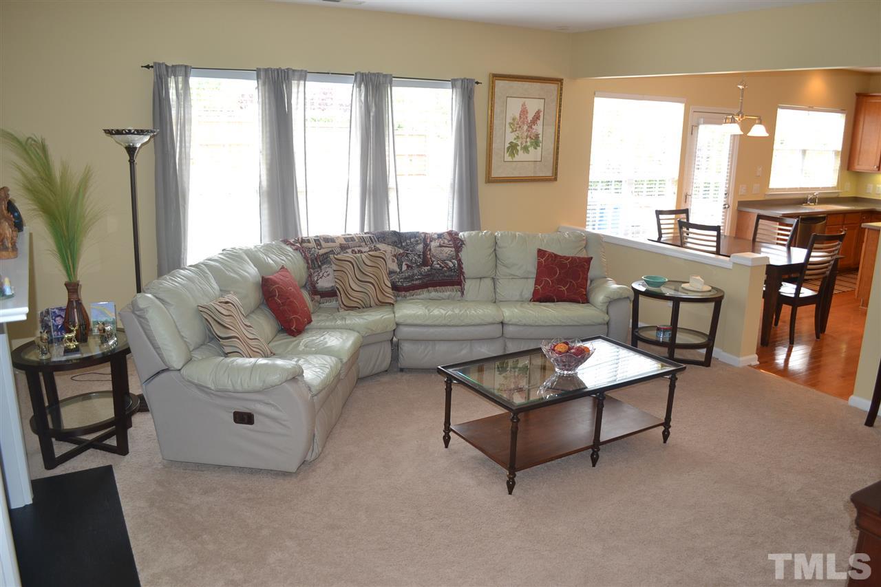 5423 Shaker Heights Lane Raleigh, NC 27613 - Photo 14 of 24 a living room with furniture and a large window