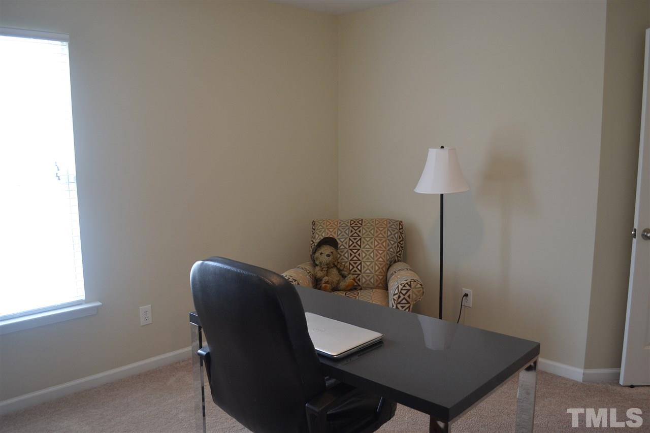 5423 Shaker Heights Lane Raleigh, NC 27613 - Photo 24 of 24 a view of a workspace with furniture and a window