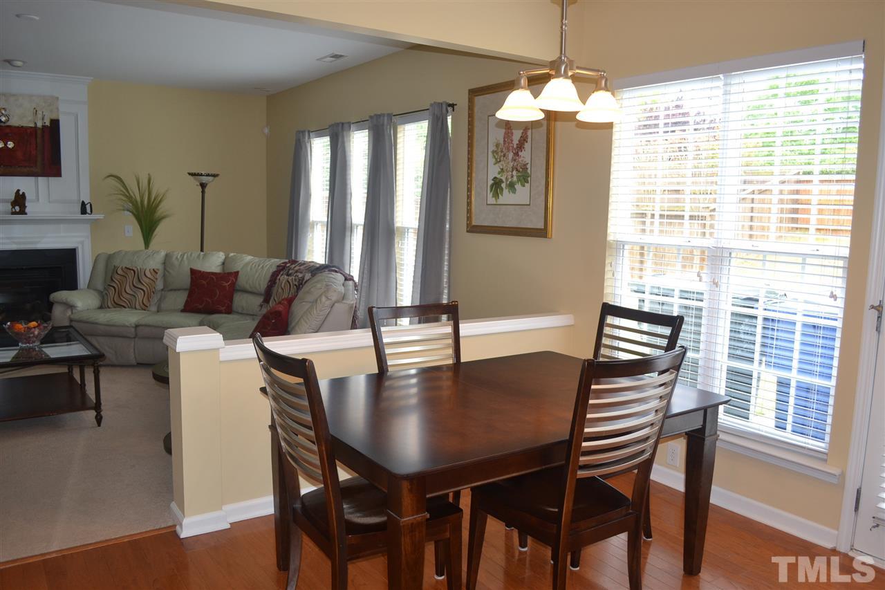 5423 Shaker Heights Lane Raleigh, NC 27613 - Photo 10 of 24 a view of a dining room with furniture and window