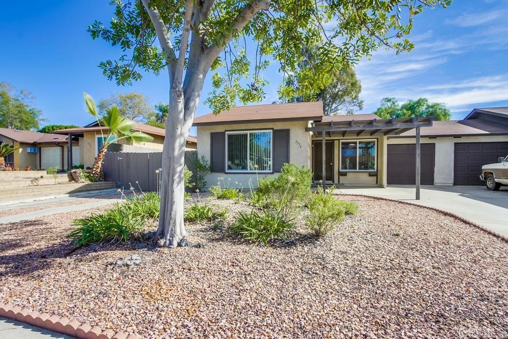 a house view with a garden space