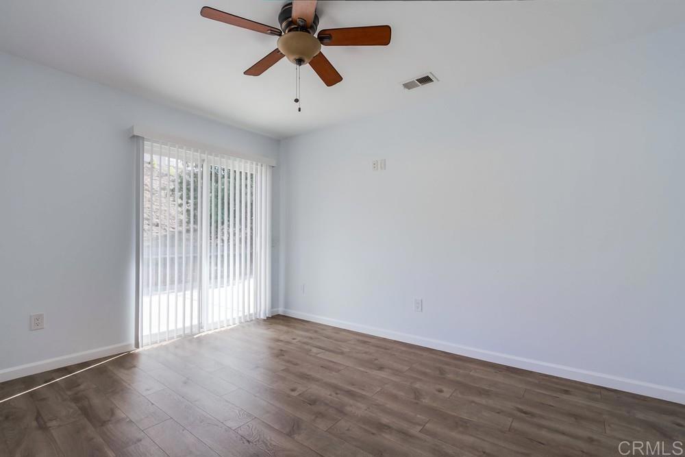 1376 Panorama Ridge Road Oceanside, CA 92056 - Photo 20 of 50 wooden floor in an empty room with a window