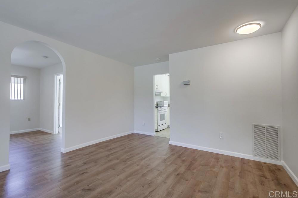 1376 Panorama Ridge Road Oceanside, CA 92056 - Photo 22 of 50 an empty room with wooden floor and windows