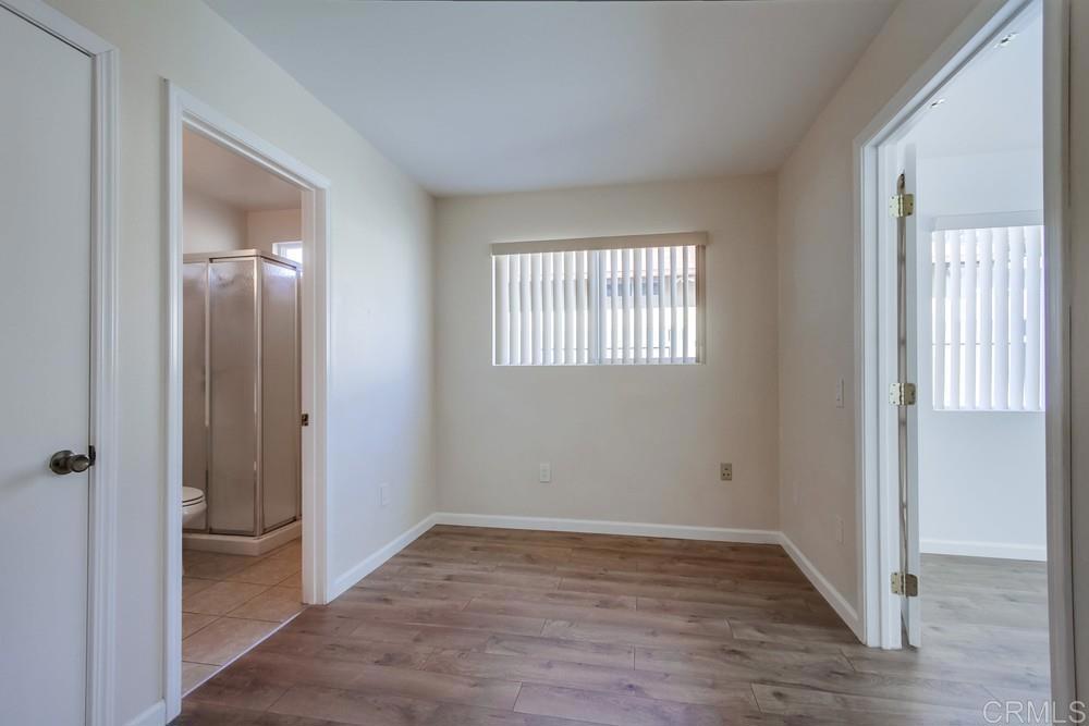 1376 Panorama Ridge Road Oceanside, CA 92056 - Photo 23 of 50 wooden floor in an empty room with a window