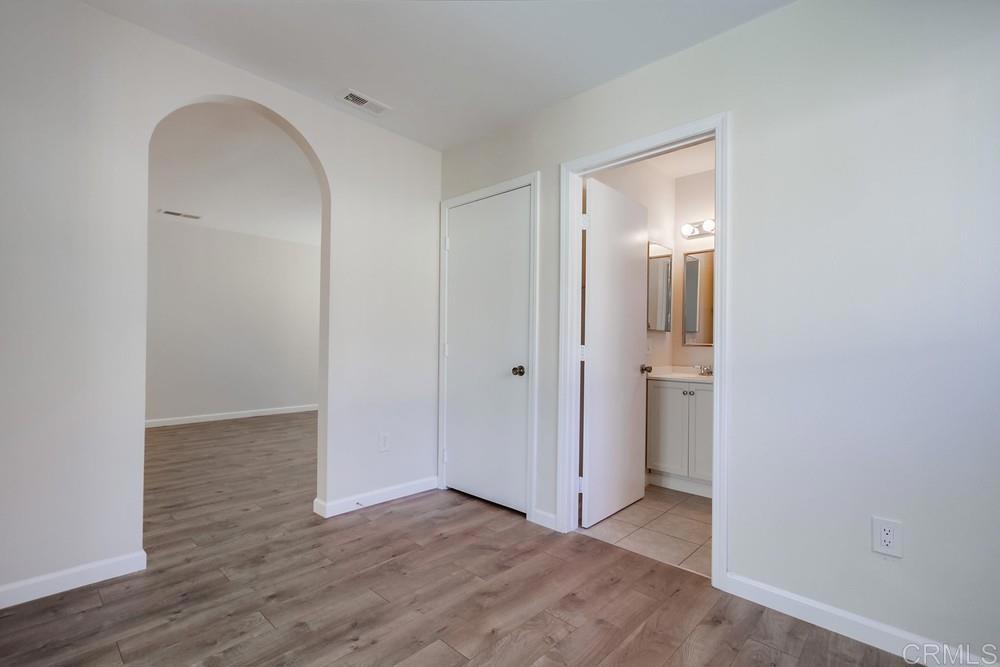 1376 Panorama Ridge Road Oceanside, CA 92056 - Photo 26 of 50 a view of an empty room with wooden floor