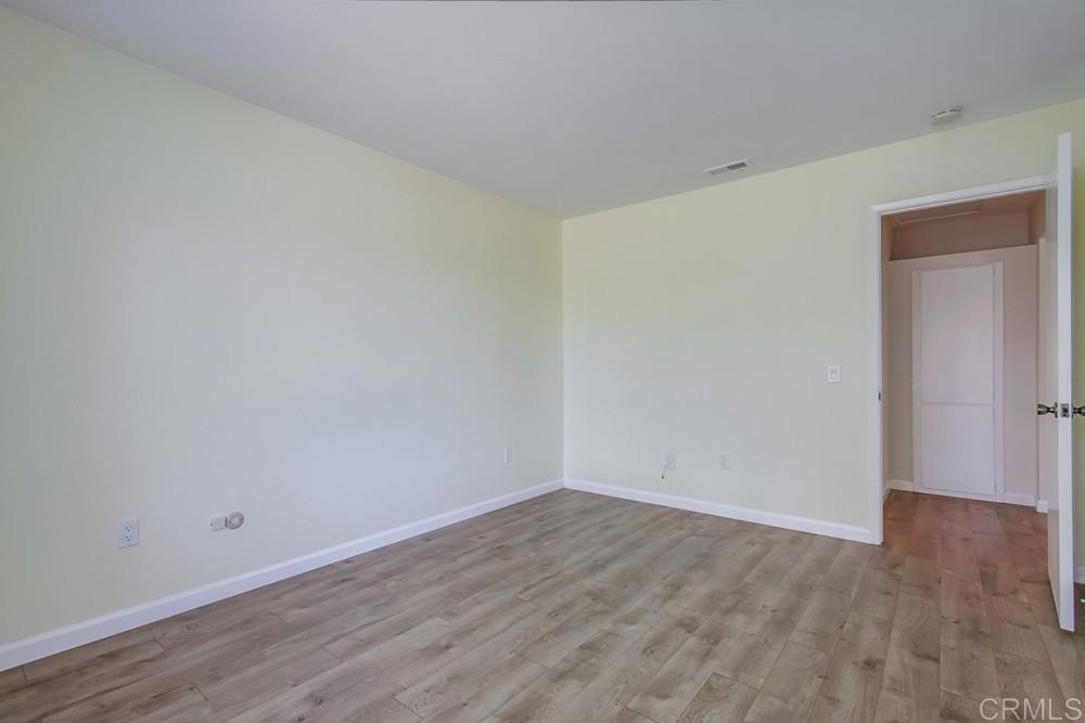 1376 Panorama Ridge Road Oceanside, CA 92056 - Photo 34 of 50 a view of an empty room with wooden floor