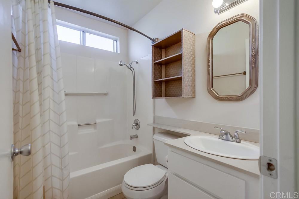 1376 Panorama Ridge Road Oceanside, CA 92056 - Photo 35 of 50 a bathroom with a sink toilet and shower