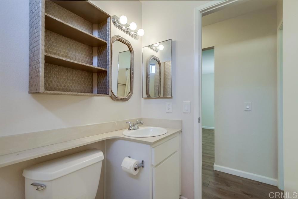 1376 Panorama Ridge Road Oceanside, CA 92056 - Photo 37 of 50 a bathroom with a sink and a mirror