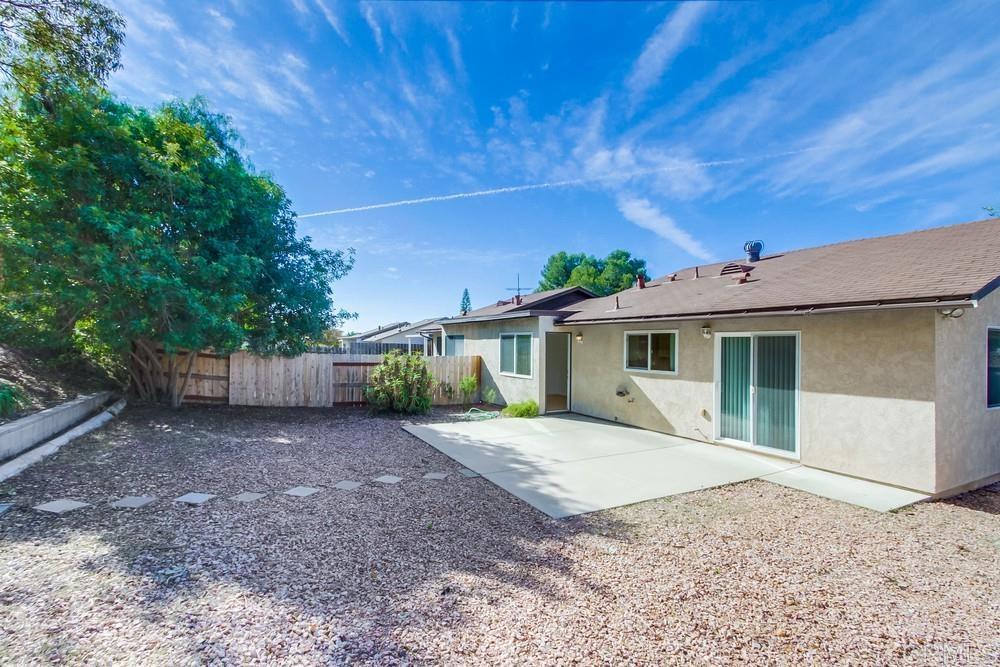 1376 Panorama Ridge Road Oceanside, CA 92056 - Photo 41 of 50 a front view of a house with a yard and garage
