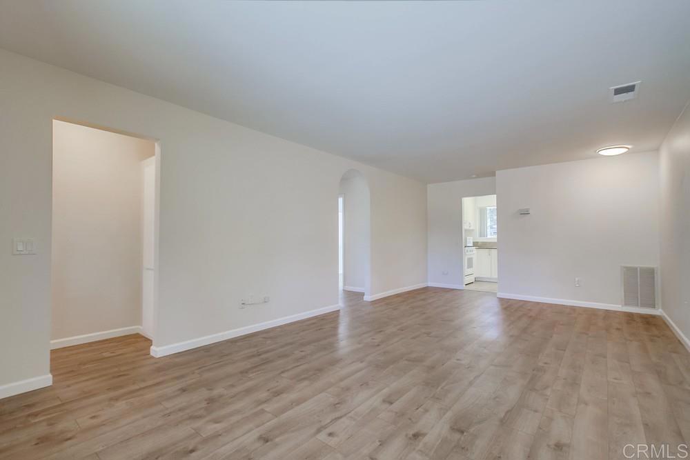 1376 Panorama Ridge Road Oceanside, CA 92056 - Photo 7 of 50 a view of an empty room with wooden floor