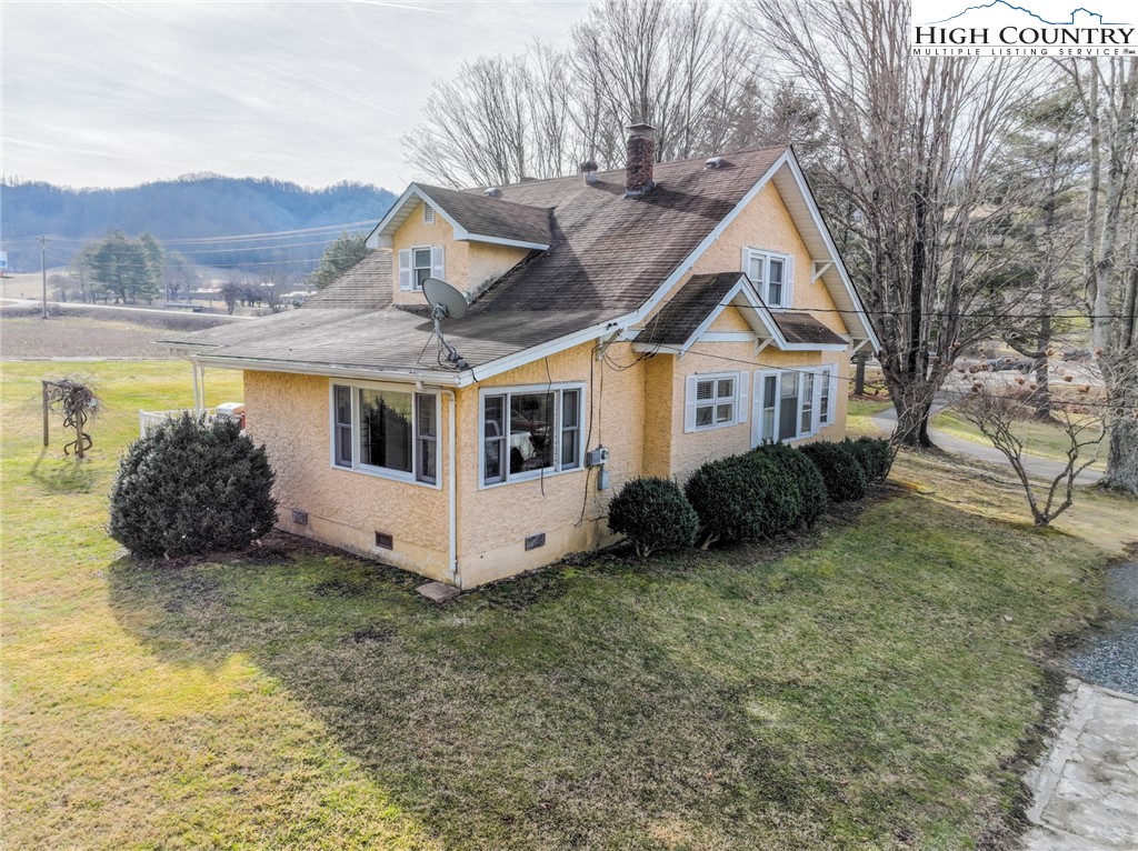 4634 Highway 421 Vilas, NC 28692 - Photo 11 of 28 a view of a house with a yard and roof