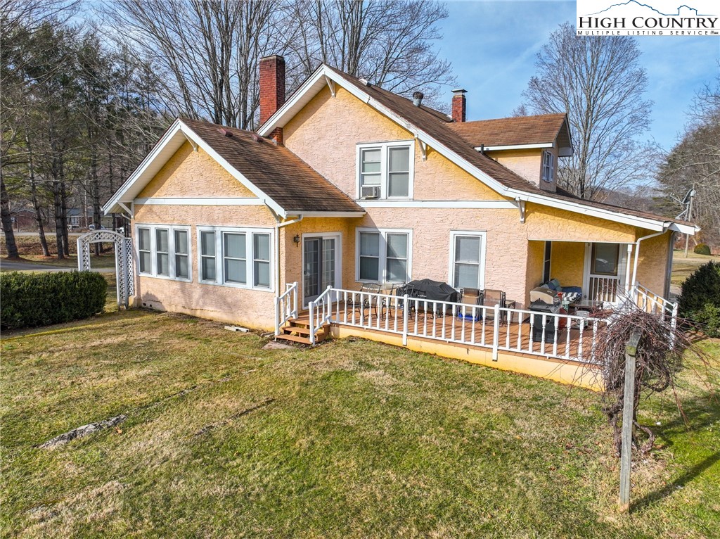 4634 Highway 421 Vilas, NC 28692 - Photo 14 of 28 a front view of a house with a garden and deck