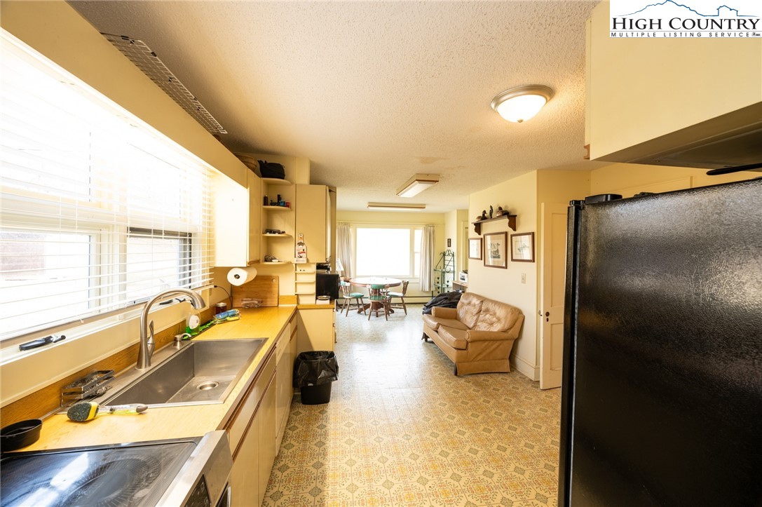 4634 Highway 421 Vilas, NC 28692 - Photo 19 of 28 a living room with furniture and a table